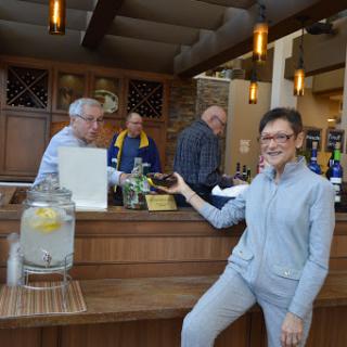 A lively bar scene where guests enjoy drinks and good company.