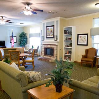 A cozy living room with comfortable seating and a fireplace.