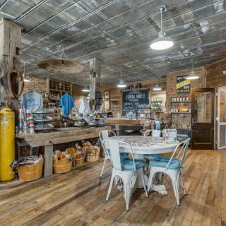 A rustic cafe interior with vintage decor and industrial design elements.