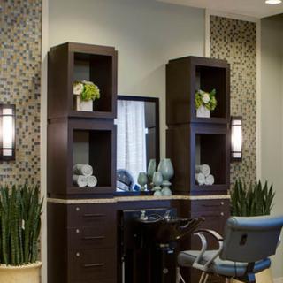 A modern beauty salon interior with stylish furniture and decor.
