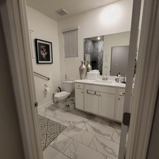 A modern bathroom interior with elegant decor and tiled flooring.
