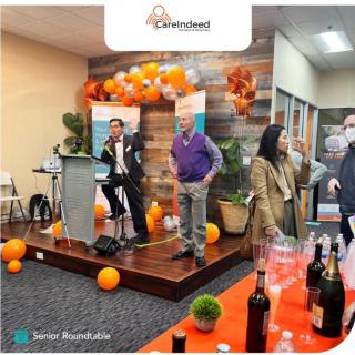 A lively event featuring speeches and colorful balloon decorations.