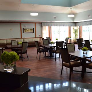 A bright and inviting dining area with tables and chairs set up for guests.