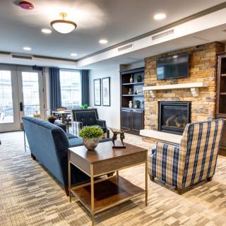A cozy living room with a fireplace and comfortable seating.