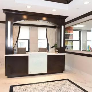 A modern bathroom with a sleek vanity and large mirrors.