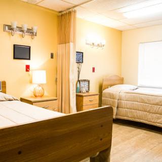 A bright and inviting hospital room designed for patient comfort.