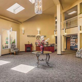 A welcoming lobby area featuring elegant decor, comfortable seating, and natural lighting.