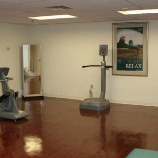 A minimalist gym with vintage exercise equipment.