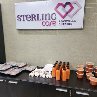 A display of food and beverages at Sterling Care, showcasing a variety of snacks and drinks for an event.