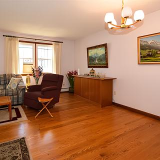 A cozy living room with hardwood floors and elegant decor.
