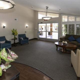 A cozy lobby area with comfortable seating and elegant lighting.