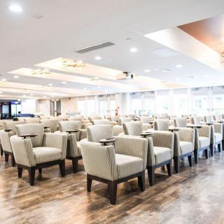 A spacious and modern conference room with arranged seating.