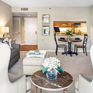 A cozy and modern living room with a dining area and stylish decor.