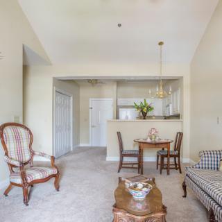 A cozy living space featuring a dining area and elegant furniture.