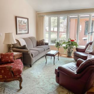 A cozy living room with comfortable seating and natural light.