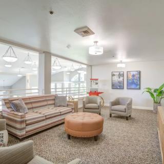 A cozy lounge area with comfortable seating and modern decor.