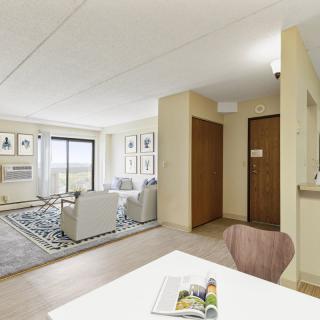 A modern apartment interior with a cozy living room and dining area.
