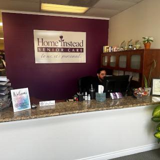 Front desk area of a Home Instead office, featuring a welcoming reception space.