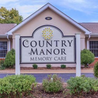 Entrance sign for Country Manor Memory Care facility.