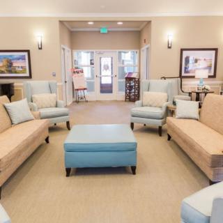 A cozy and elegant living room with comfortable seating and tasteful decor.