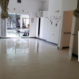 A spacious, empty room with modern decor and ample natural light.