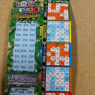 A colorful bingo scratch-off lottery ticket featuring multiple game boards.