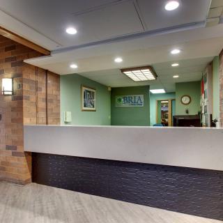 A modern reception area with a sleek design and ambient lighting.