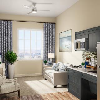 A modern living room with stylish decor and a large window providing ample natural light.