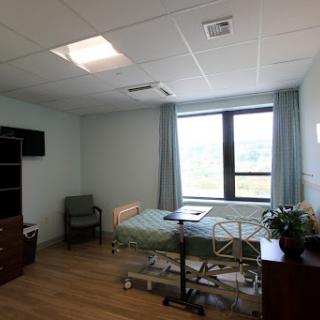 A bright and spacious hospital room designed for patient care.