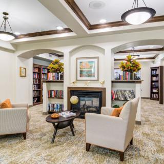 A modern library interior with comfortable seating and an elegant design.