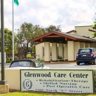 Glenwood Care Center with a sign displaying available services such as rehabilitation, skilled nursing, and post-operative care.