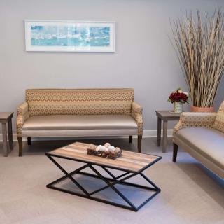 A modern living room with elegant furniture and minimalist decor.