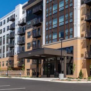 Modern apartment building with multiple floors and balconies.