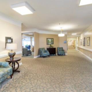 A well-lit hallway with comfortable seating and decorative elements.
