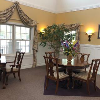 A cozy dining area with elegant furnishings and soft lighting.