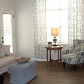 A cozy living room with elegant furniture and natural light.