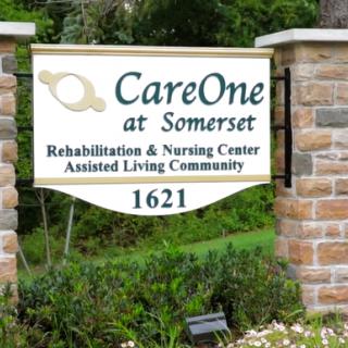 Outdoor sign for CareOne at Somerset, a rehabilitation and nursing center offering assisted living services.