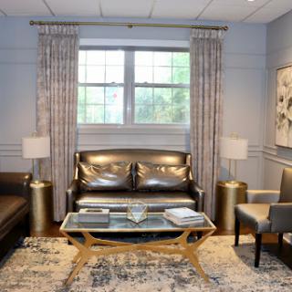 A cozy and modern living room setup featuring sleek furniture and elegant decor.