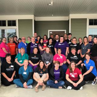 A vibrant gathering of team members enjoying a moment together.