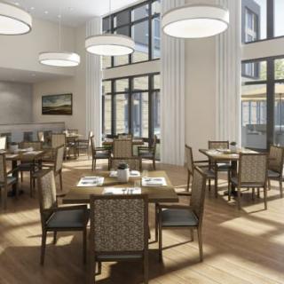 A modern dining area with elegant tables and chairs, featuring large windows and stylish lighting.