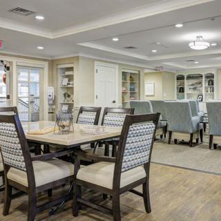A well-designed dining room with elegant furniture and lighting.