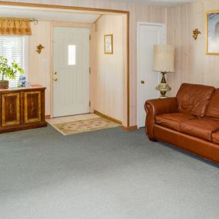 A cozy living room with a leather sofa and stylish decor.
