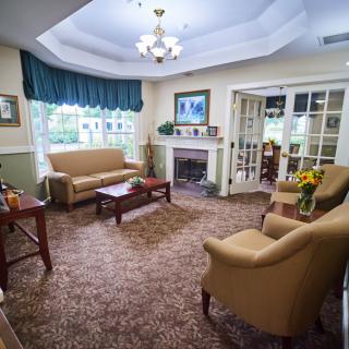 A cozy living room with comfortable seating and a fireplace.