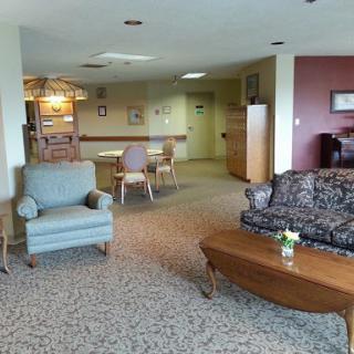 A cozy lounge area featuring comfortable furniture and a warm, inviting atmosphere.