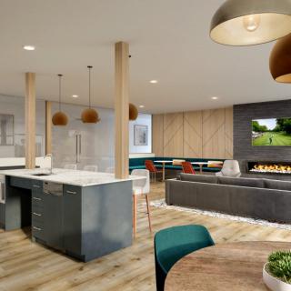A modern open floor plan featuring a stylish kitchen and cozy living area.