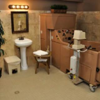 A luxurious bathroom setting featuring a sink, mirror, and spa equipment.