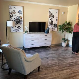 A cozy living room setup featuring modern furniture and decorative elements.