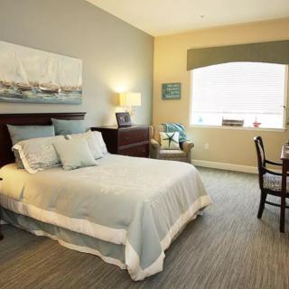 A cozy and elegantly decorated bedroom with soft lighting.