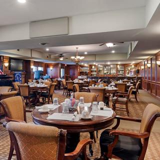 An elegant dining area in a restaurant, featuring well-arranged tables and chairs.