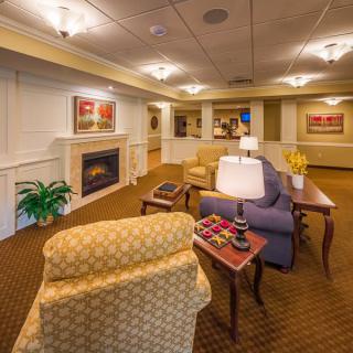 A cozy living room with comfortable seating and a fireplace.